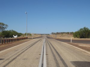 Standing on the Stuart Highway by day